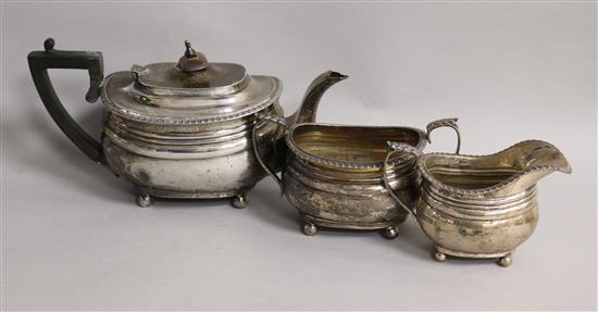 A George V silver three piece bachelors tea set by Goldsmiths & Silversmiths Co Ltd, London, 1915, gross 20 oz.